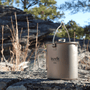 Kuvik titanium mug on a rock with natural background